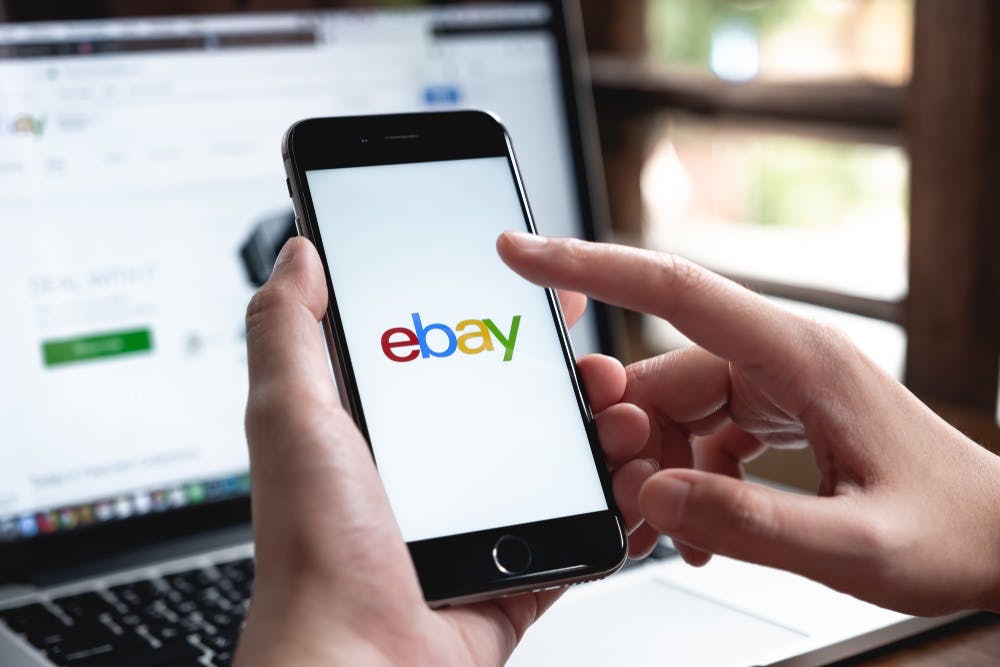 How can you change your eBay account's currency to various options like British Pound Sterling, Canadian Dollars, Australian Dollars, and Indian Rupees